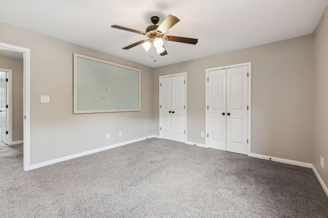 3296 Wiser Dr, Clarksville, TN 37042 - unfurnished bedroom featuring two closets, carpet, and a ceiling fan