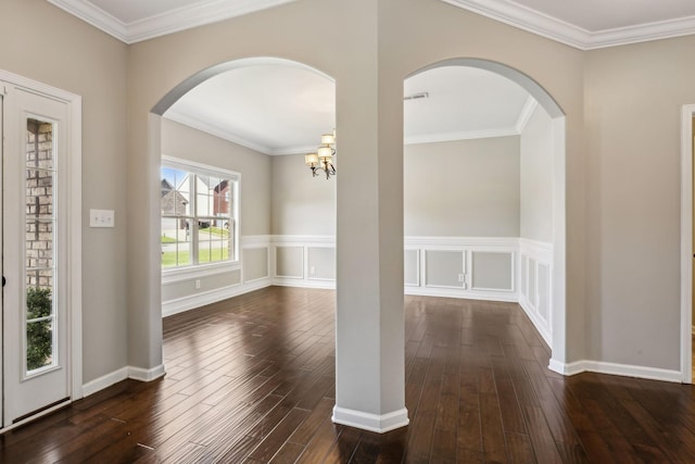 3296 Wiser Dr, Clarksville, TN 37042 - unfurnished room with dark wood-type flooring, arched walkways, crown molding, and a chandelier