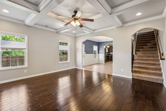 3296 Wiser Dr, Clarksville, TN 37042 - unfurnished living room featuring arched walkways, coffered ceiling, wood finished floors, ceiling fan, and stairs