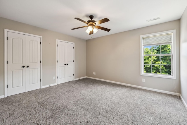 3296 Wiser Dr, Clarksville, TN 37042 - unfurnished bedroom with multiple closets, carpet flooring, and ceiling fan