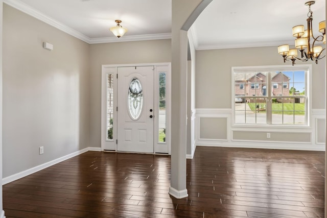 3296 Wiser Dr, Clarksville, TN 37042 - foyer entrance with a chandelier, ornamental molding, arched walkways, and hardwood / wood-style floors