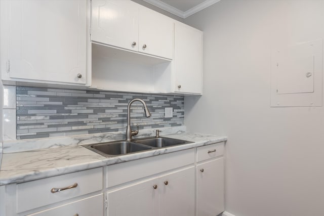3600 Hillsboro Pike Unit A1, Nashville, TN 37215 - kitchen featuring a sink, electric panel, crown molding, light countertops, and decorative backsplash
