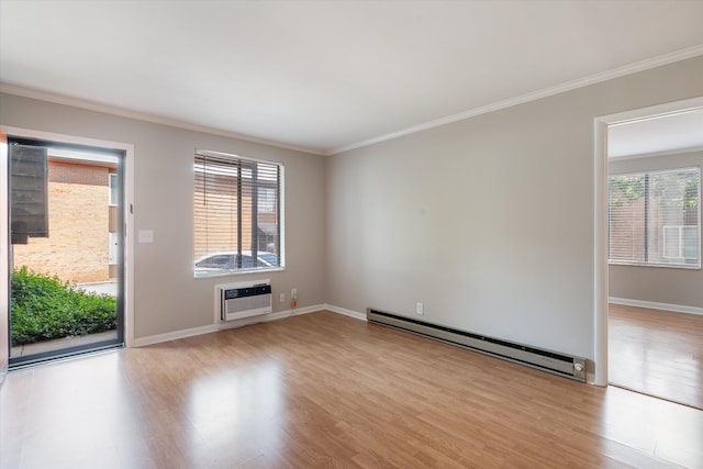 3600 Hillsboro Pike Unit A1, Nashville, TN 37215 - empty room with a baseboard heating unit, light wood-type flooring, an AC wall unit, ornamental molding, and baseboards