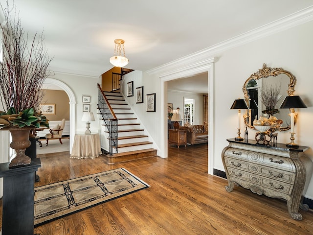 504 Chippenham Ct, Franklin, TN 37069 - foyer entrance featuring stairway, ornamental molding, arched walkways, wood finished floors, and baseboards