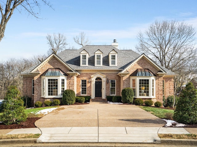 504 Chippenham Ct, Franklin, TN 37069 - view of front of home featuring brick siding, a chimney, and roof with shingles