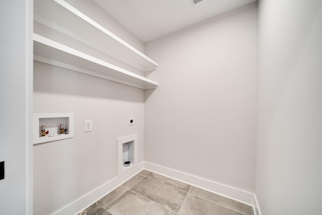 2120 Burns St, Nashville, TN 37216 - laundry room featuring electric dryer hookup, hookup for a washing machine, baseboards, and light tile patterned floors