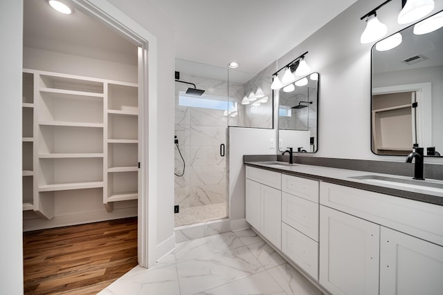 2120 Burns St, Nashville, TN 37216 - bathroom featuring a marble finish shower, double vanity, marble finish flooring, and recessed lighting