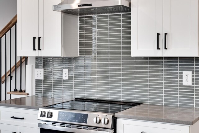 2120 Burns St, Nashville, TN 37216 - kitchen featuring stainless steel electric range, decorative backsplash, under cabinet range hood, and dark stone counters