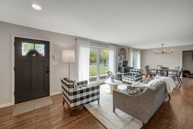 418 Boyd Mill Ave, Franklin, TN 37064 - living room with wood finished floors, a chandelier, and baseboards