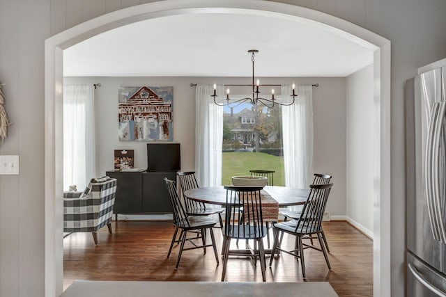 418 Boyd Mill Ave, Franklin, TN 37064 - dining area with wood finished floors, arched walkways, plenty of natural light, and a chandelier