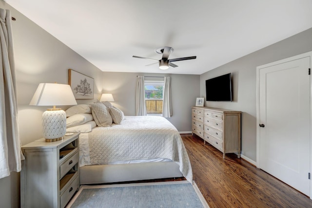 418 Boyd Mill Ave, Franklin, TN 37064 - bedroom with dark wood-style floors, a ceiling fan, and baseboards