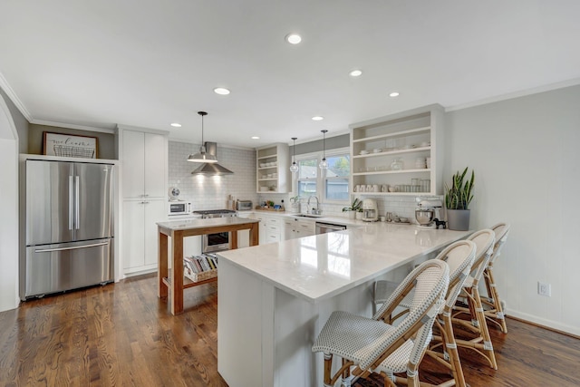 418 Boyd Mill Ave, Franklin, TN 37064 - kitchen featuring stainless steel appliances, open shelves, a sink, crown molding, and decorative backsplash