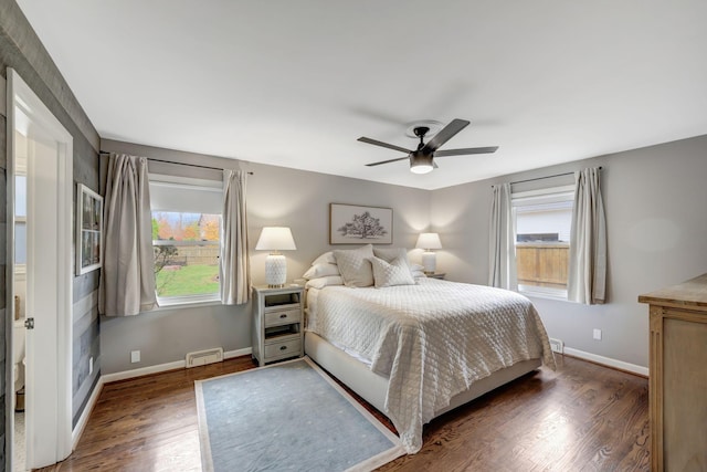 418 Boyd Mill Ave, Franklin, TN 37064 - bedroom featuring multiple windows, dark wood-style floors, and baseboards