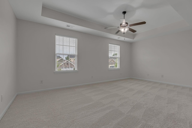 1039 Hemlock Dr, Spring Hill, TN 37174 - unfurnished room with a tray ceiling, baseboards, light carpet, and a ceiling fan
