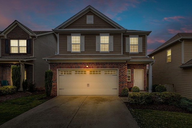 1039 Hemlock Dr, Spring Hill, TN 37174 - traditional-style house with an attached garage, brick siding, and driveway