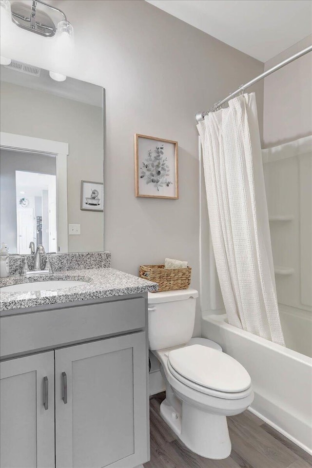 8792 Snowy Owl Rd, Ooltewah, TN 37363 - full bath with wood finished floors, shower / tub combo, and vanity