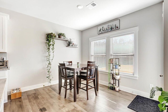 8792 Snowy Owl Rd, Ooltewah, TN 37363 - dining room with light wood finished floors