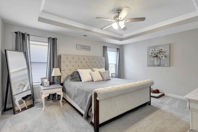 8792 Snowy Owl Rd, Ooltewah, TN 37363 - bedroom with a raised ceiling, light colored carpet, and ceiling fan