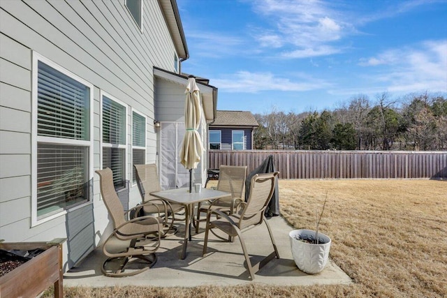 8792 Snowy Owl Rd, Ooltewah, TN 37363 - fenced backyard with outdoor dining area and a patio area