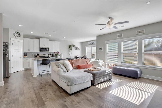 8792 Snowy Owl Rd, Ooltewah, TN 37363 - living room with ceiling fan, light wood-type flooring, and recessed lighting