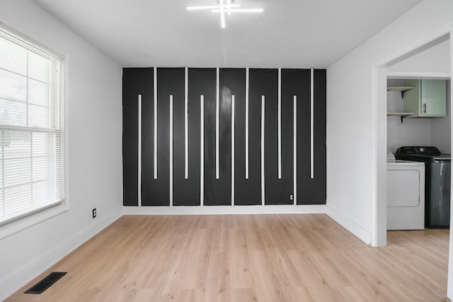 925 Tommy Oliver Rd, Clarksville, TN 37042 - unfurnished living room featuring washer and clothes dryer and light wood finished floors