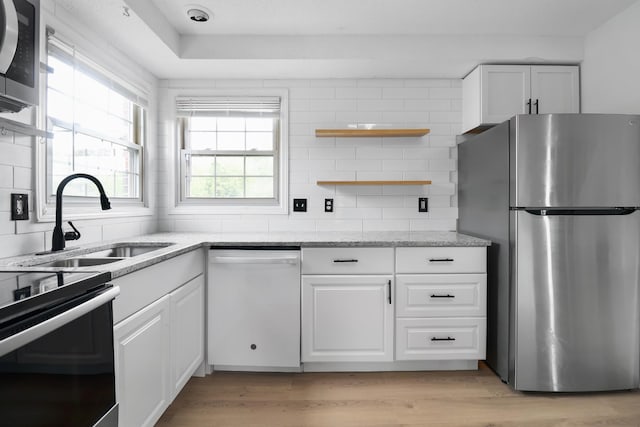 925 Tommy Oliver Rd, Clarksville, TN 37042 - kitchen with stainless steel appliances, open shelves, white cabinets, and backsplash