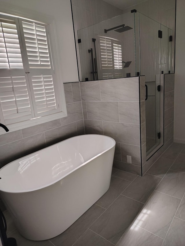 1202 Willow Brook Pass, Mount Juliet, TN 37122 - bathroom featuring a freestanding tub and a stall shower