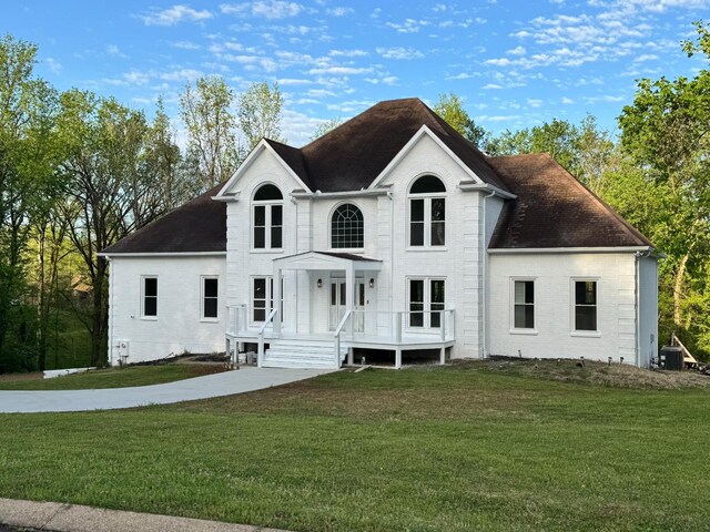 1202 Willow Brook Pass, Mount Juliet, TN 37122 - view of front of home featuring a front lawn, brick siding, and a shingled roof