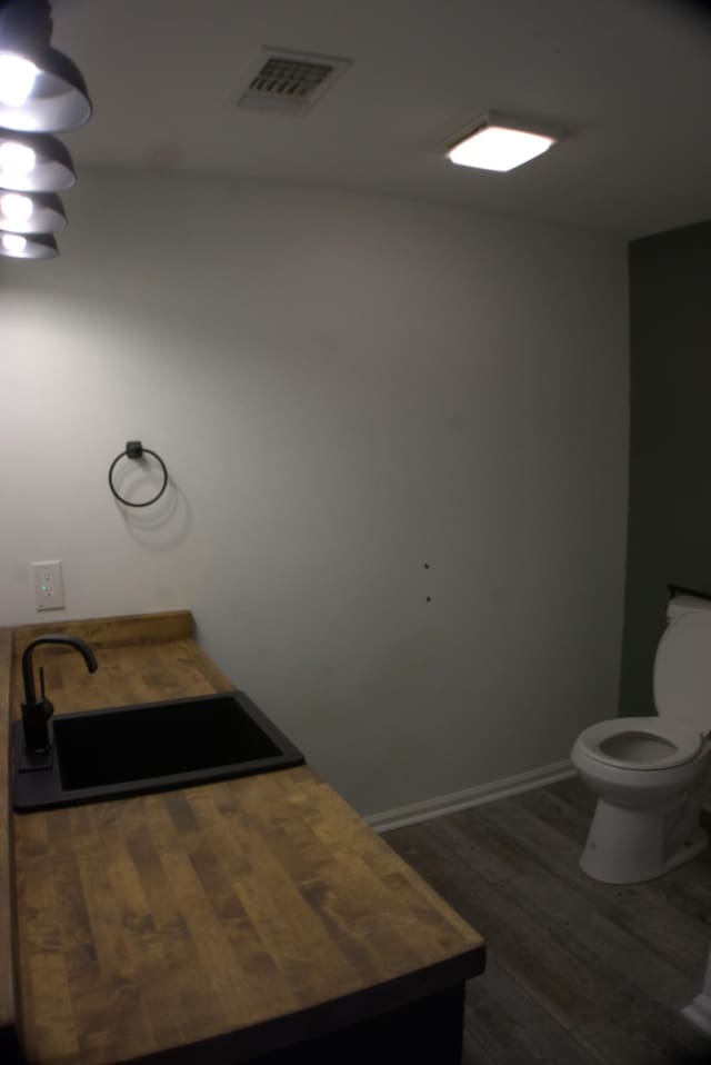 1202 Willow Brook Pass, Mount Juliet, TN 37122 - bathroom featuring toilet, wood finished floors, and a sink