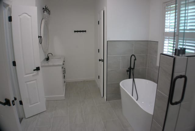 1202 Willow Brook Pass, Mount Juliet, TN 37122 - full bathroom featuring vanity, a freestanding bath, and baseboards