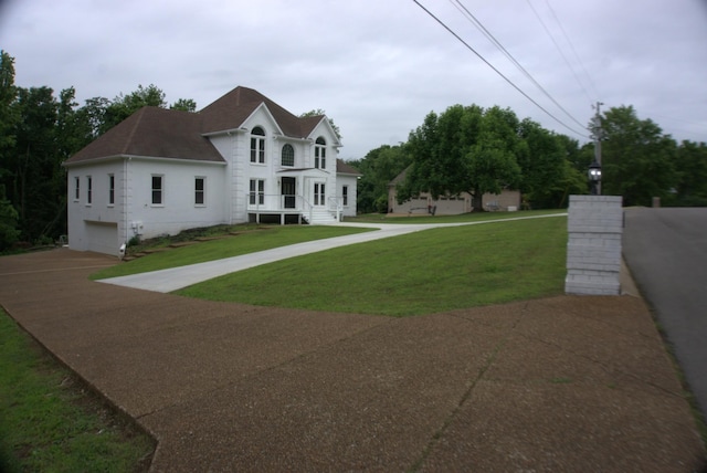1202 Willow Brook Pass, Mount Juliet, TN 37122 - view of front of home with an attached garage, concrete driveway, a shingled roof, and a front yard