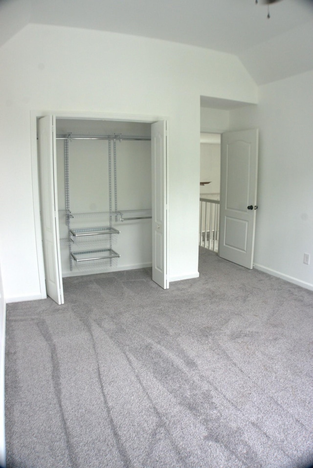 1202 Willow Brook Pass, Mount Juliet, TN 37122 - unfurnished bedroom with lofted ceiling, carpet floors, a closet, and baseboards