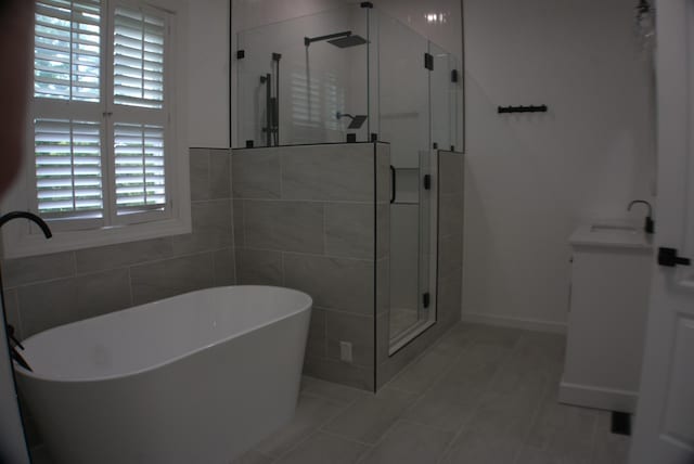 1202 Willow Brook Pass, Mount Juliet, TN 37122 - bathroom featuring a stall shower, a freestanding bath, vanity, and tile patterned flooring