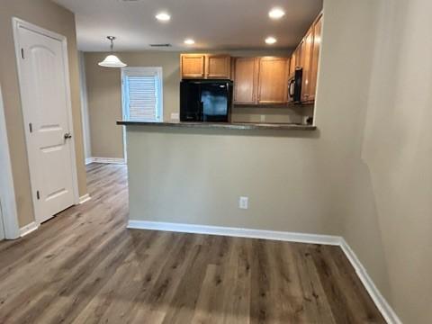 312 Mapleton Aly, Hermitage, TN 37076 - kitchen featuring fridge, baseboards, recessed lighting, a peninsula, and wood finished floors