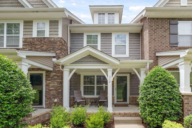 312 Mapleton Aly, Hermitage, TN 37076 - property entrance featuring covered porch and stone siding