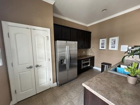 312 Mapleton Aly, Hermitage, TN 37076 - kitchen with appliances with stainless steel finishes, crown molding, backsplash, baseboards, and a sink