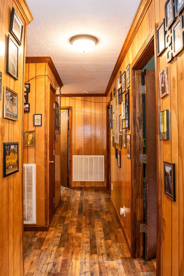 135 Old Union Church Rd, Holladay, TN 38341 - corridor with a textured ceiling, dark wood-type flooring, wood walls, and ornamental molding