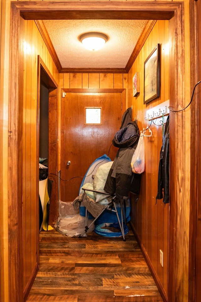 135 Old Union Church Rd, Holladay, TN 38341 - doorway to outside featuring ornamental molding, wooden walls, wood finished floors, and a textured ceiling