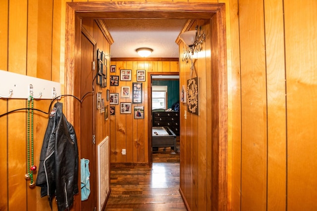 135 Old Union Church Rd, Holladay, TN 38341 - hall with dark wood-type flooring, wooden walls, a textured ceiling, and ornamental molding