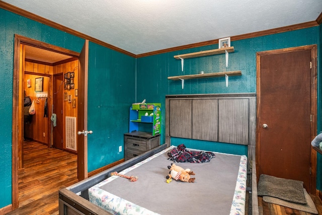 135 Old Union Church Rd, Holladay, TN 38341 - recreation room with ornamental molding, wood finished floors, and a textured ceiling