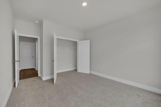 8545 Ari Ln, Chattanooga, TN 37421 - unfurnished bedroom with light colored carpet, baseboards, and a closet