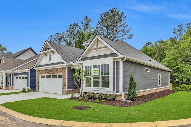 8545 Ari Ln, Chattanooga, TN 37421 - craftsman-style home with an attached garage, a front lawn, roof with shingles, concrete driveway, and brick siding