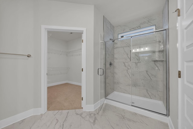 8545 Ari Ln, Chattanooga, TN 37421 - bathroom with a marble finish shower, baseboards, marble finish floors, and a spacious closet