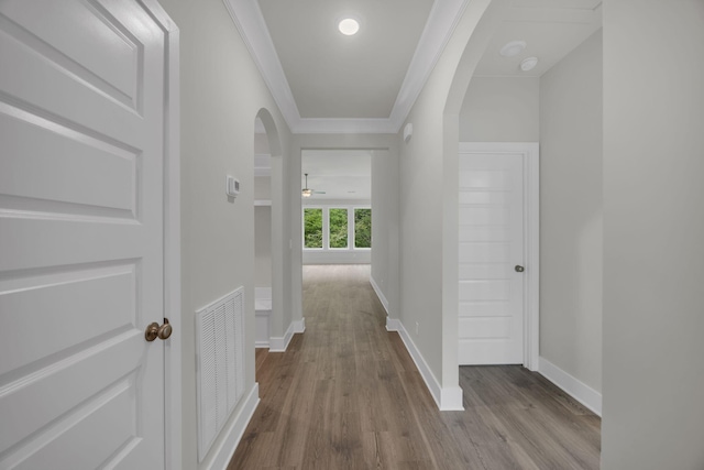 8545 Ari Ln, Chattanooga, TN 37421 - corridor featuring arched walkways, dark wood finished floors, crown molding, and baseboards