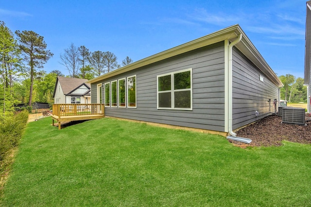 8545 Ari Ln, Chattanooga, TN 37421 - rear view of property featuring central AC unit, a deck, and a yard