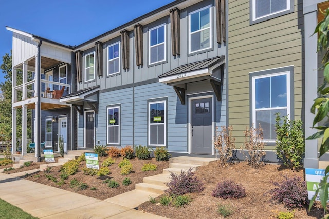 2413 E 17th St, Chattanooga, TN 37404 - view of front of property with a balcony, board and batten siding, and a standing seam roof