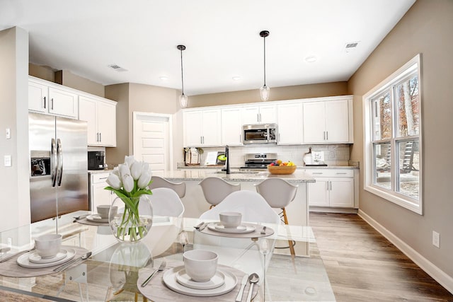 8529 Ari Ln, Chattanooga, TN 37421 - dining space with light wood finished floors, recessed lighting, and baseboards
