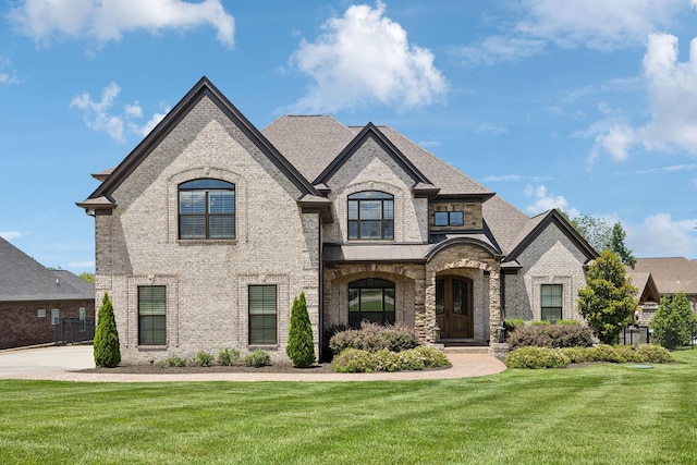 1300 Stovall Ln, Mount Juliet, TN 37122 - french country style house featuring brick siding and a front lawn