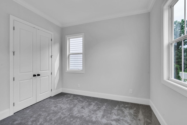 7139 Frances St, Fairview, TN 37062 - unfurnished bedroom featuring dark carpet, multiple windows, ornamental molding, baseboards, and a closet