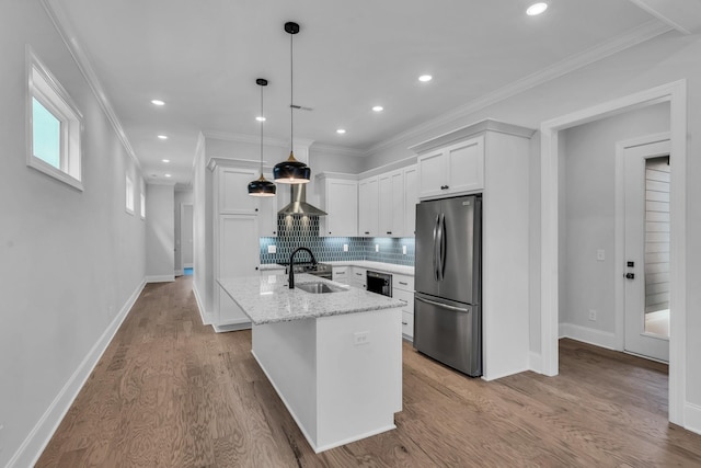 7139 Frances St, Fairview, TN 37062 - kitchen featuring freestanding refrigerator, white cabinets, an island with sink, backsplash, and a sink
